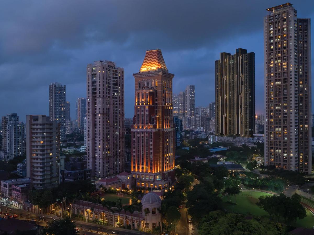 a lit up building in a city at night at ITC Grand Central, a Luxury Collection Hotel, Mumbai in Mumbai