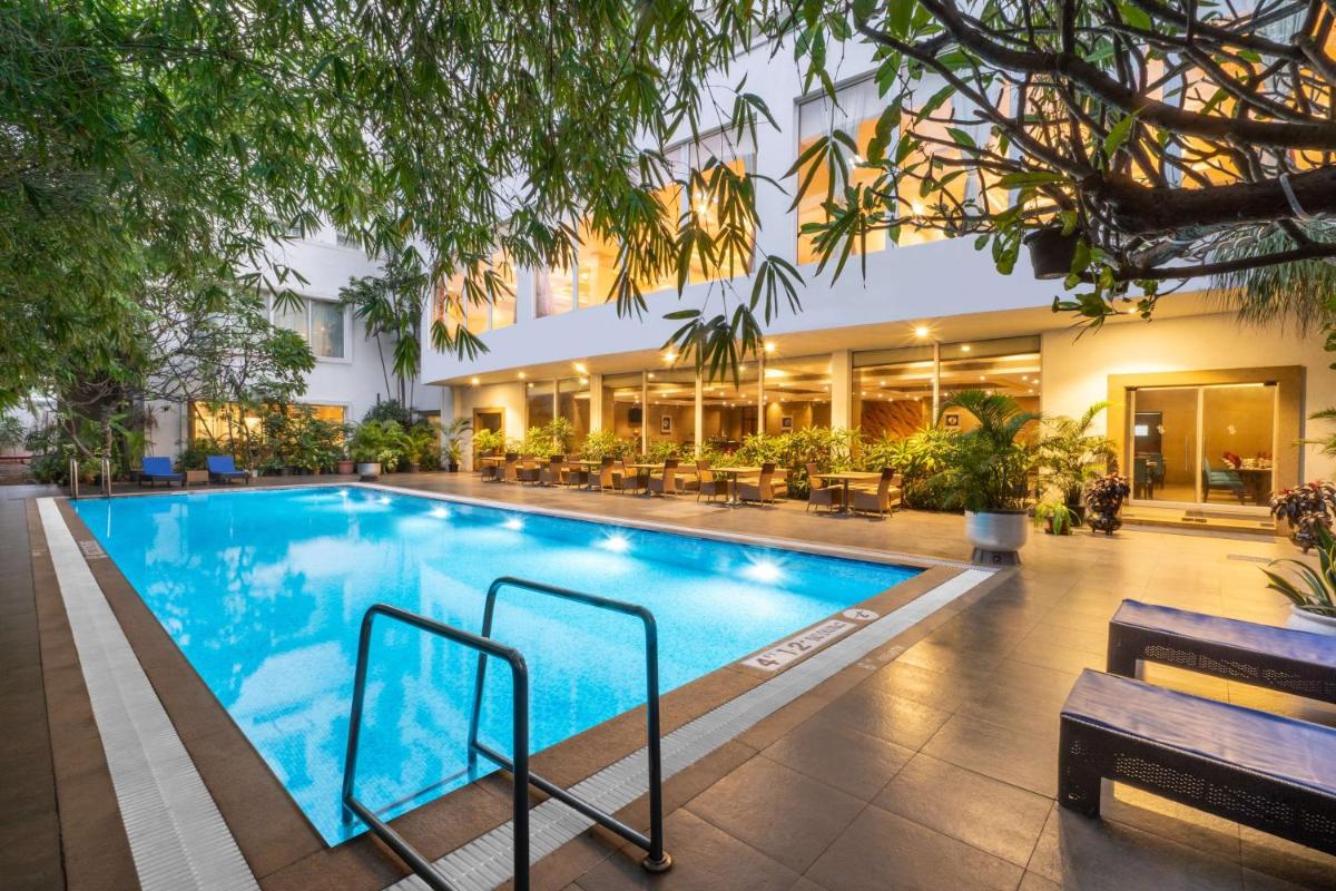 a swimming pool in front of a building at Park Plaza Chennai OMR in Chennai