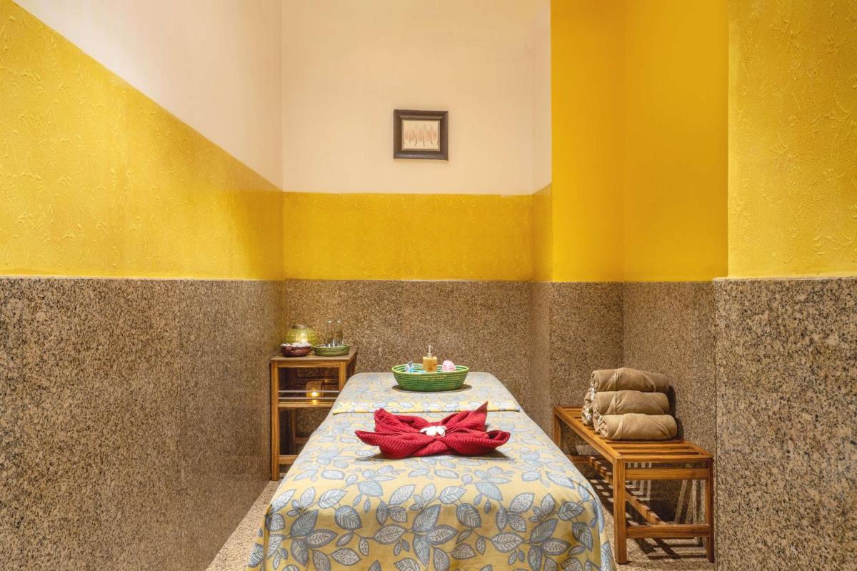 a bedroom with a bed with a red bow on it at Park Plaza Chennai OMR in Chennai