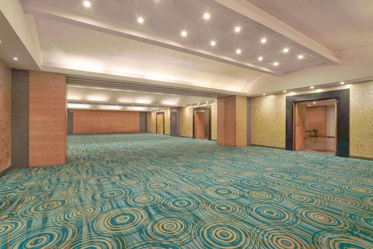 a large ballroom with a large room with a carpeted floor at Park Plaza Chennai OMR in Chennai