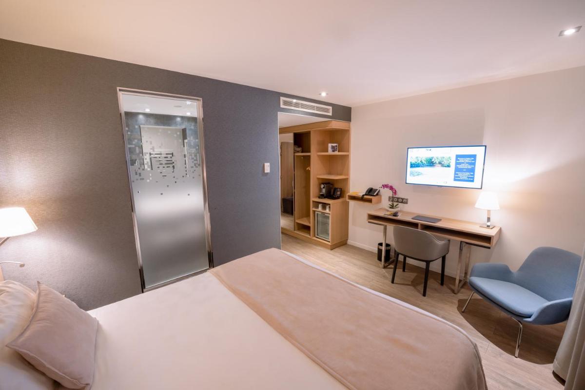Un ou plusieurs lits dans un hébergement de l'établissement Golden Tulip Sophia Antipolis - Hotel & Spa