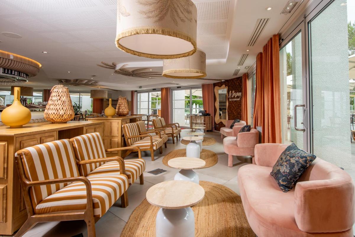 Coin salon dans l'établissement Golden Tulip Sophia Antipolis - Hotel & Spa