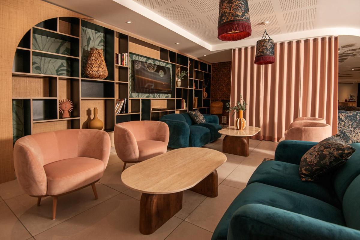 Coin salon dans l'établissement Golden Tulip Sophia Antipolis - Hotel & Spa
