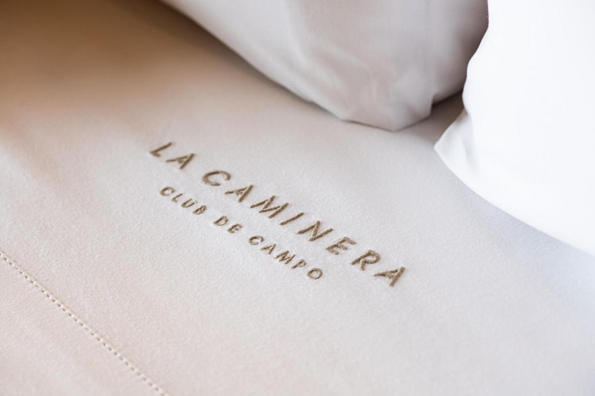 Cama o camas de una habitación en Hotel La Caminera Club de Campo