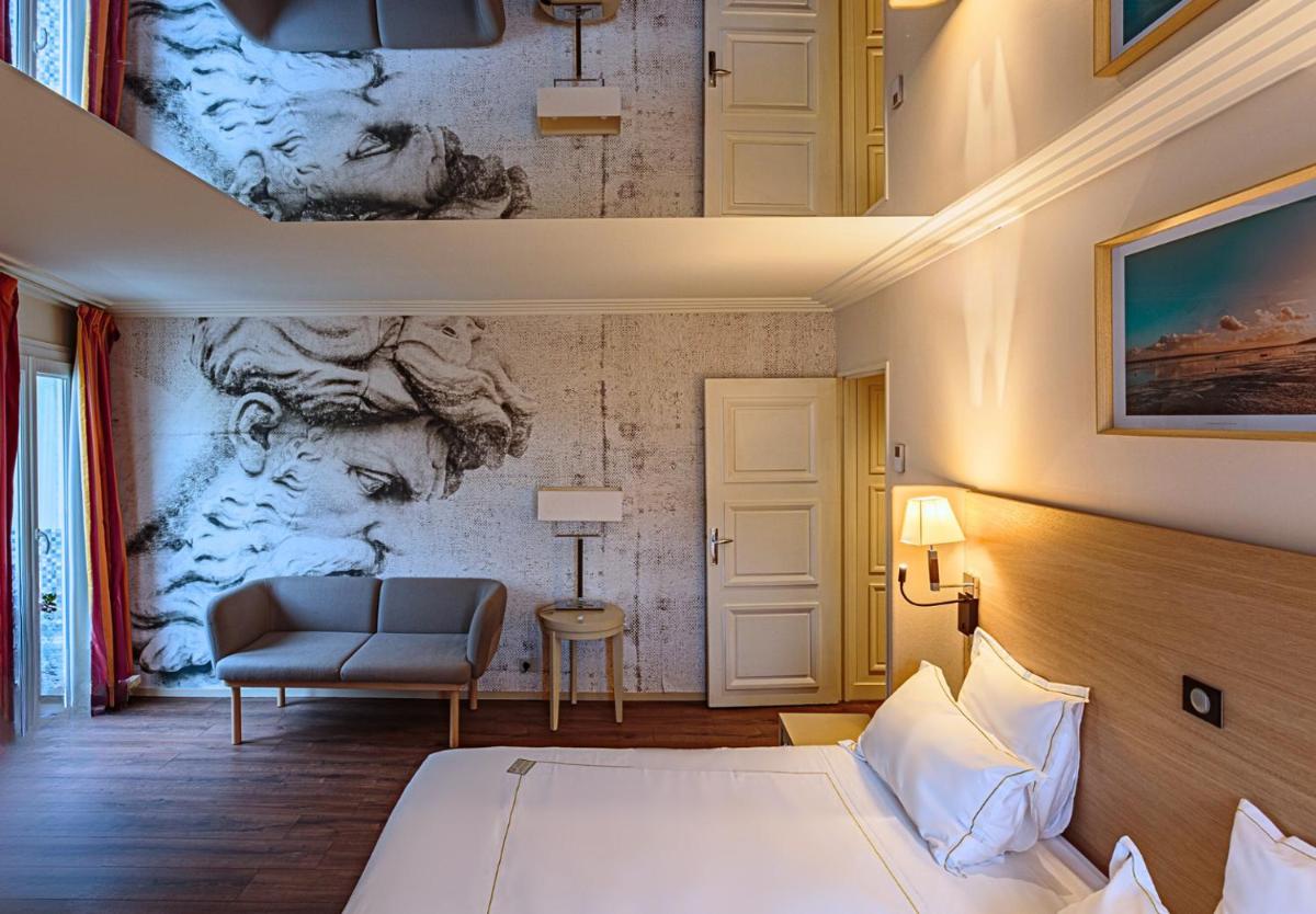 Un ou plusieurs lits dans un hébergement de l'établissement Grand Tonic Hotel & SPA NUXE