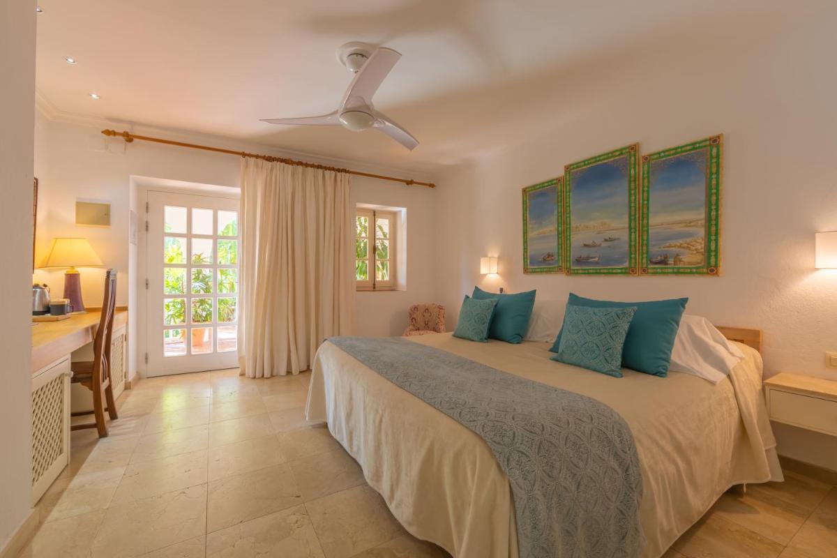 Cama o camas de una habitación en Hurricane Beach Hotel