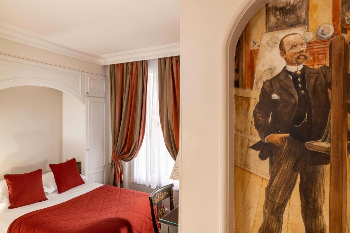 Un ou plusieurs lits dans un hébergement de l'établissement Hotel & Spa Saint-Jacques