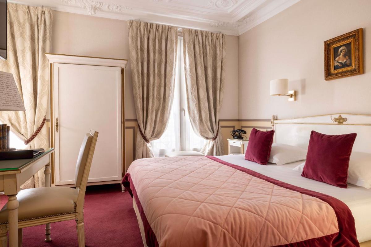 Un ou plusieurs lits dans un hébergement de l'établissement Hotel & Spa Saint-Jacques