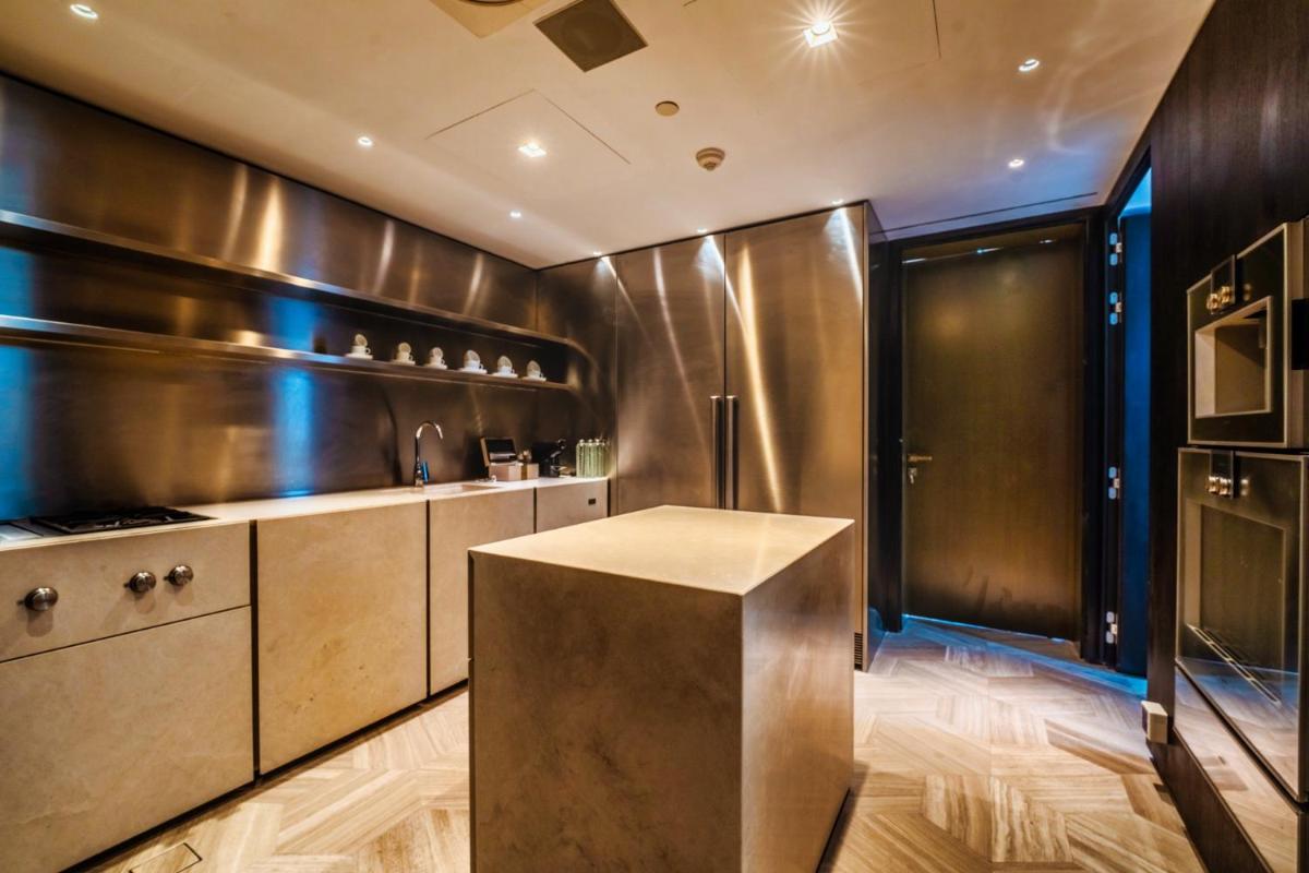 a kitchen with stainless steel appliances and a counter at FIVE Palm Jumeirah Dubai in Dubai
