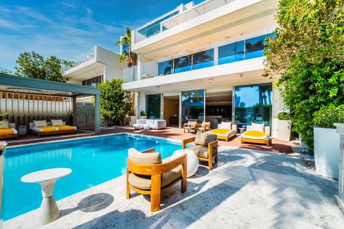 an exterior view of a house with a swimming pool at FIVE Palm Jumeirah Dubai in Dubai an exterior view of a house with a swimming pool at FIVE Palm Jumeirah Dubai in Dubai