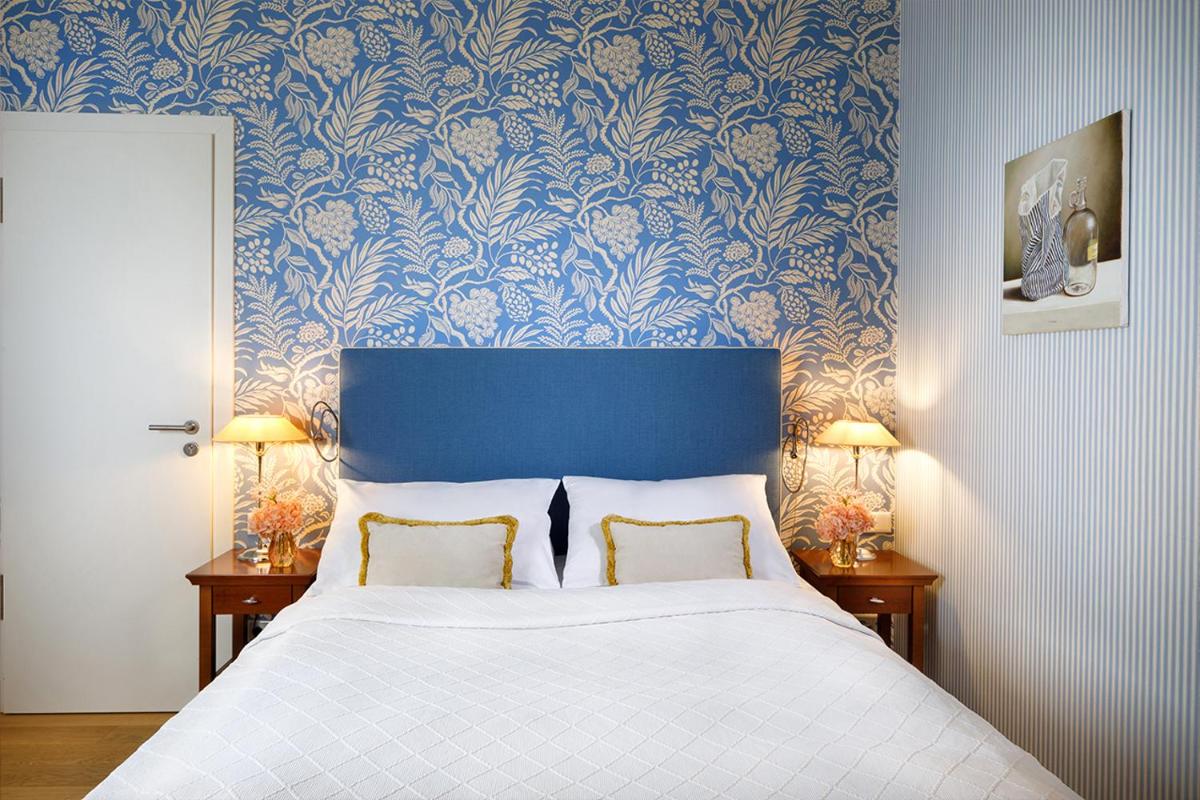 Ein Bett oder Betten in einem Zimmer der Unterkunft Hotel Goliath am Dom