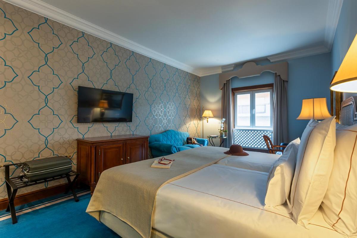 Uma cama ou camas num quarto em Pestana Palace Lisboa Hotel & National Monument - The Leading Hotels of the World