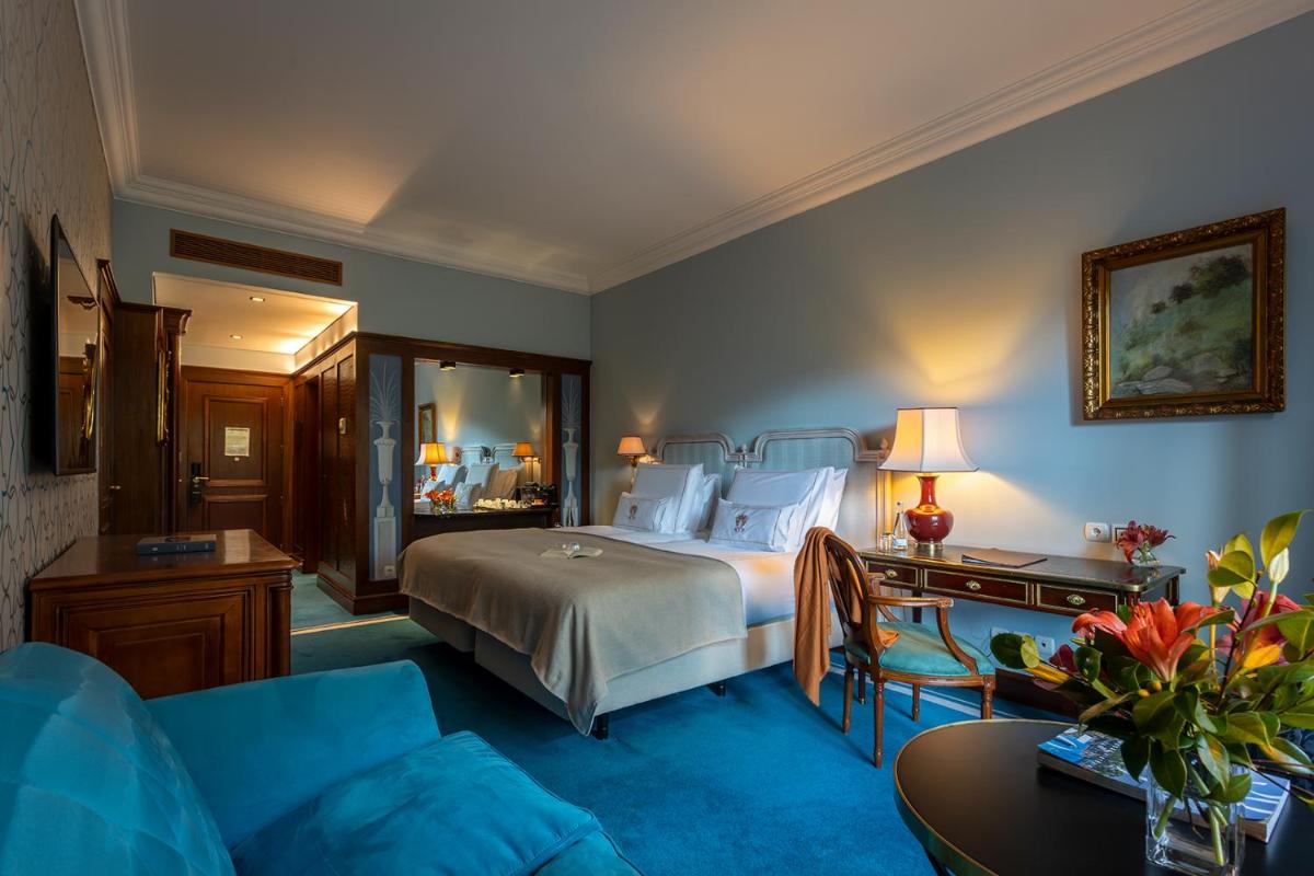 Uma cama ou camas num quarto em Pestana Palace Lisboa Hotel & National Monument - The Leading Hotels of the World
