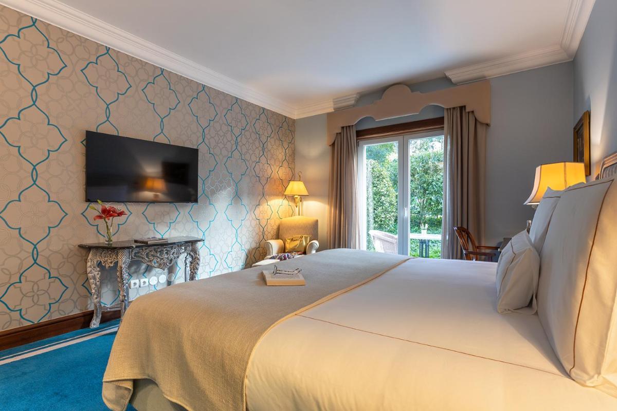 Uma cama ou camas num quarto em Pestana Palace Lisboa Hotel & National Monument - The Leading Hotels of the World