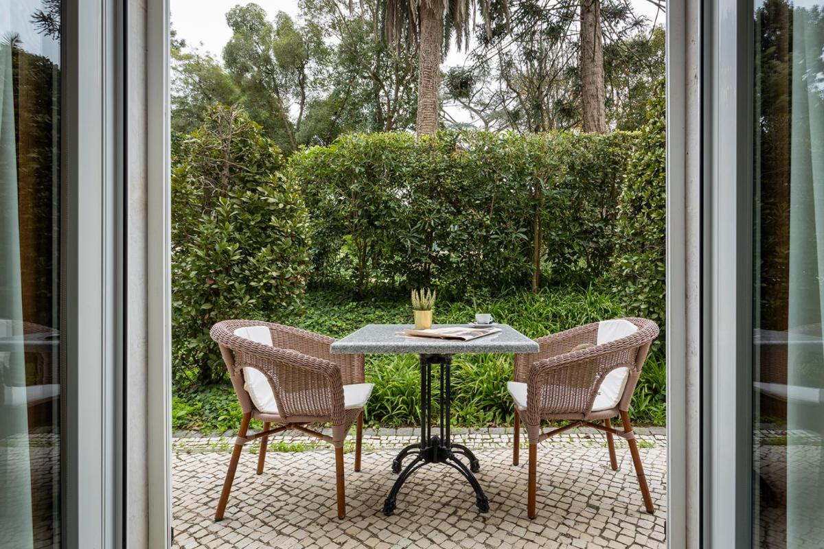 Um jardim no exterior de Pestana Palace Lisboa Hotel & National Monument - The Leading Hotels of the World