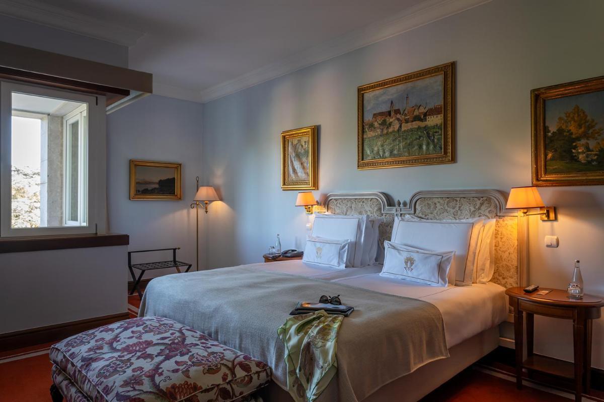 Uma cama ou camas num quarto em Pestana Palace Lisboa Hotel & National Monument - The Leading Hotels of the World