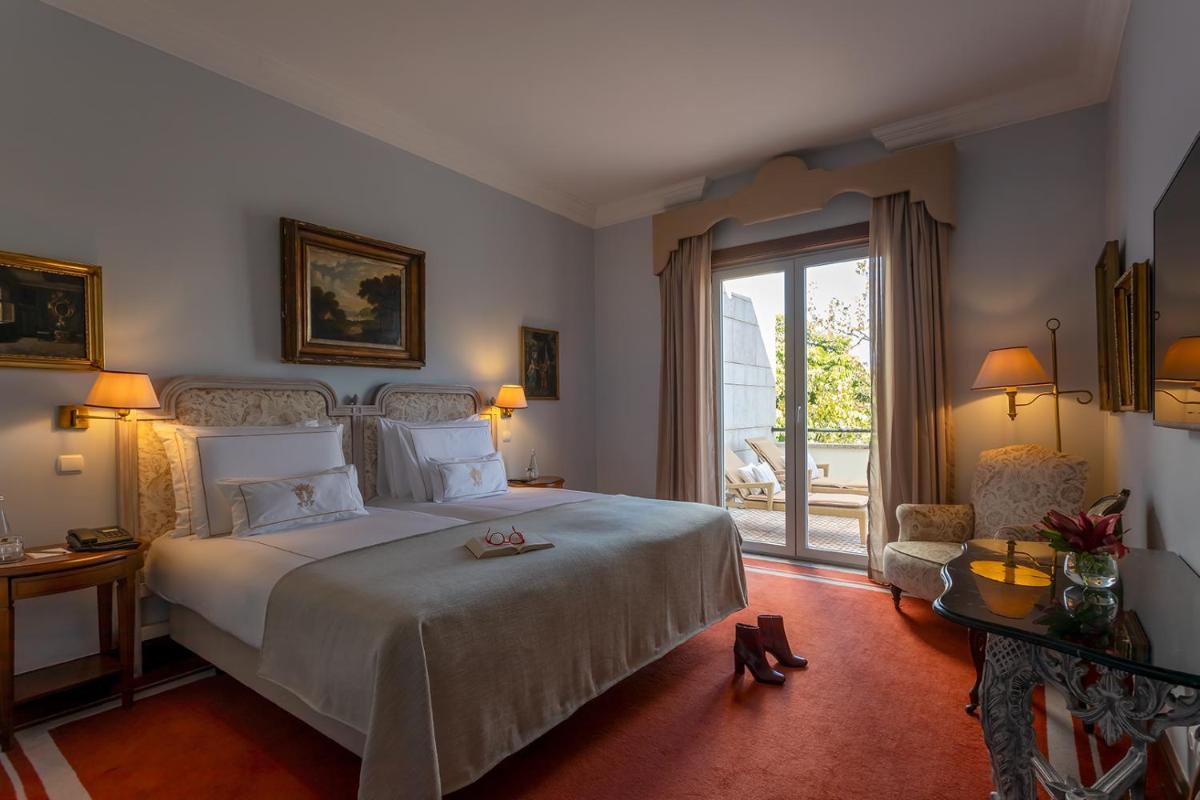 Uma cama ou camas num quarto em Pestana Palace Lisboa Hotel & National Monument - The Leading Hotels of the World