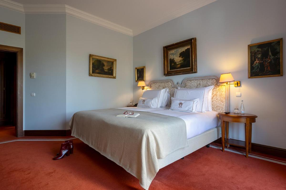 Uma cama ou camas num quarto em Pestana Palace Lisboa Hotel & National Monument - The Leading Hotels of the World