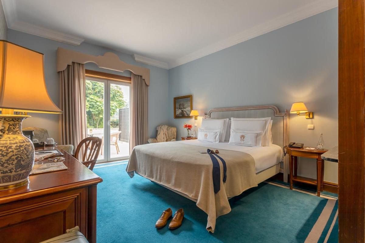 Uma cama ou camas num quarto em Pestana Palace Lisboa Hotel & National Monument - The Leading Hotels of the World