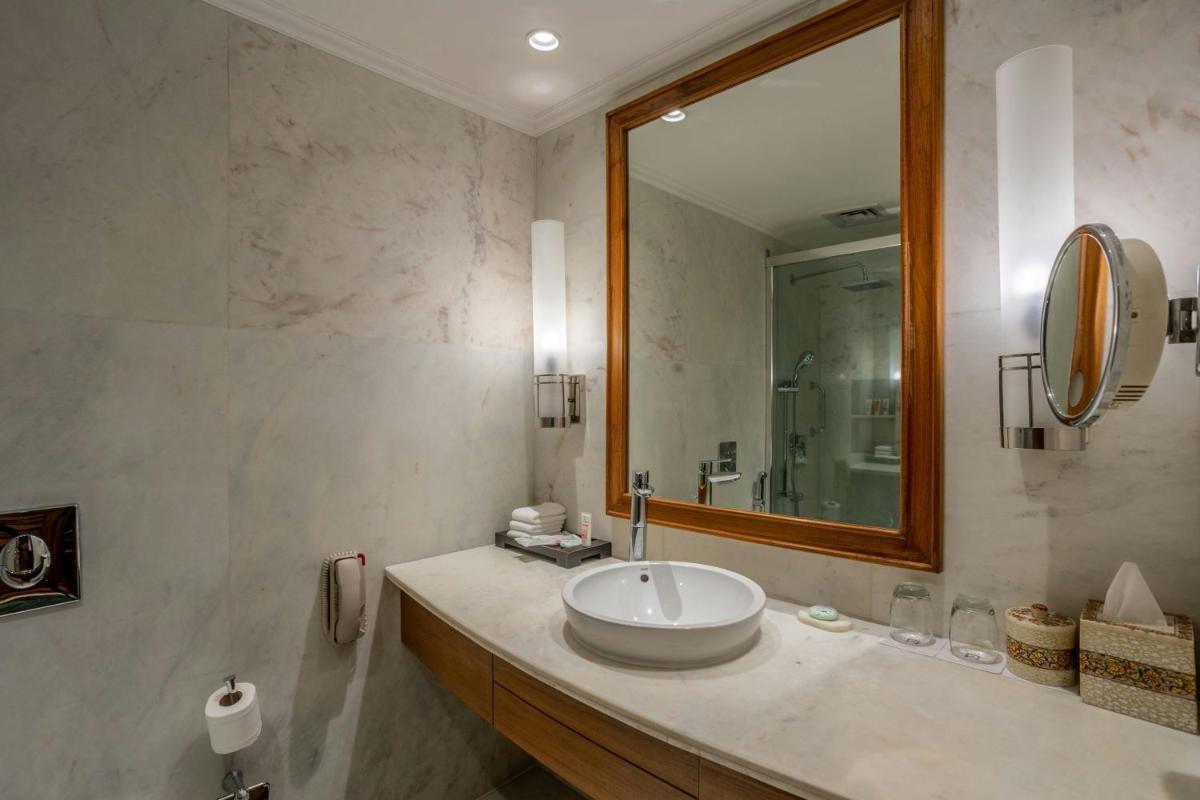 a bathroom with a sink and a mirror at ITC Mughal, A Luxury Collection Resort & Spa, Agra in Agra
