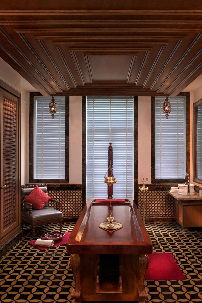 a room with a pool table in a room with windows at ITC Mughal, A Luxury Collection Resort & Spa, Agra in Agra