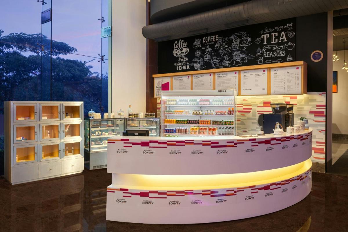 a store with a counter in a room at Aloft Bengaluru Outer Ring Road in Bengaluru