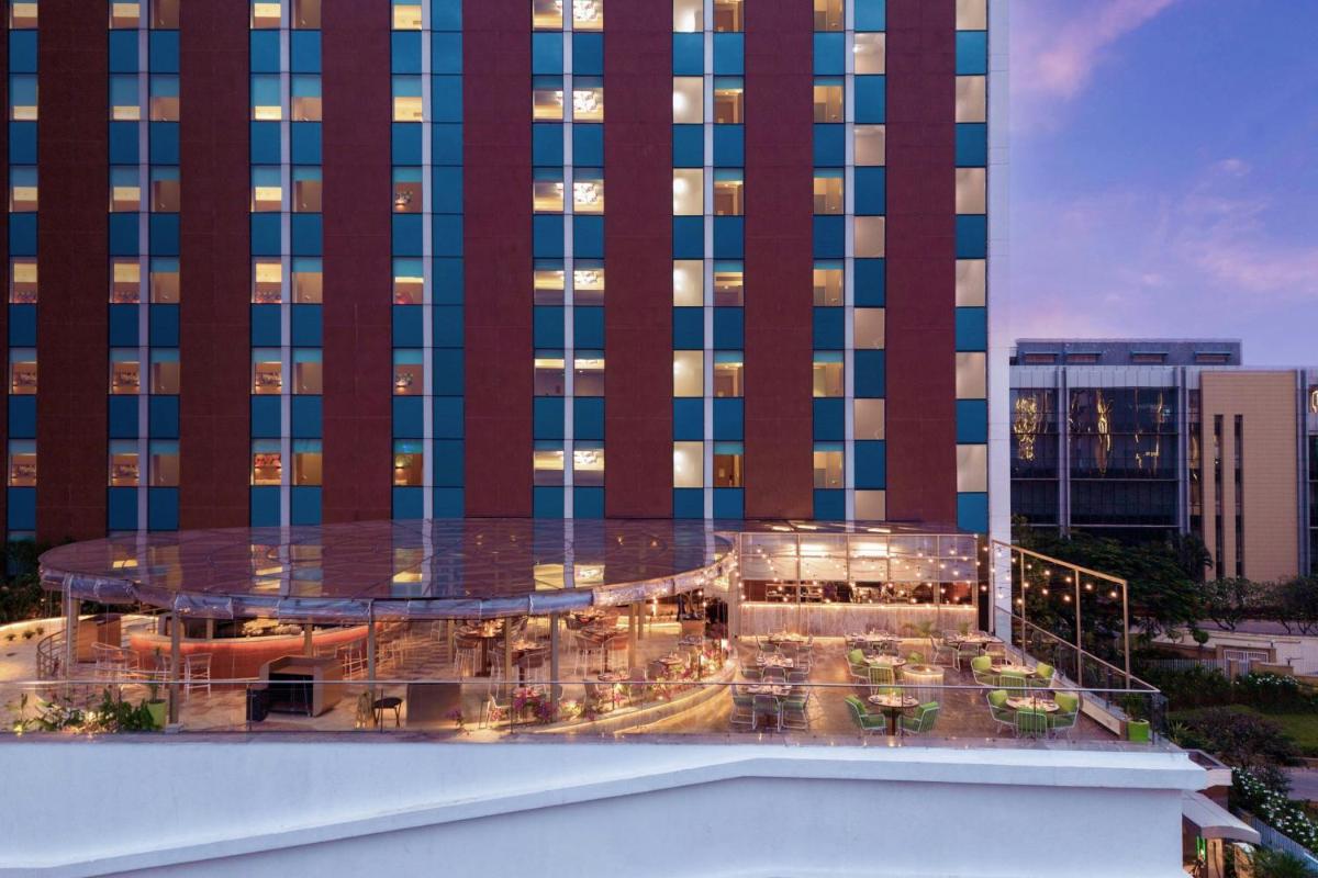 a view of a hotel with a building at Aloft Bengaluru Outer Ring Road in Bengaluru