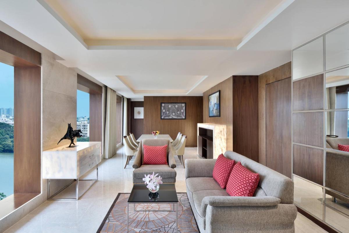 a living room with a couch and a table at Courtyard by Marriott Bengaluru Hebbal in Bengaluru