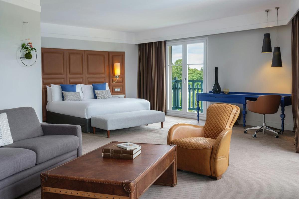 Un ou plusieurs lits dans un hébergement de l'établissement Renaissance Paris Hippodrome de St. Cloud Hotel