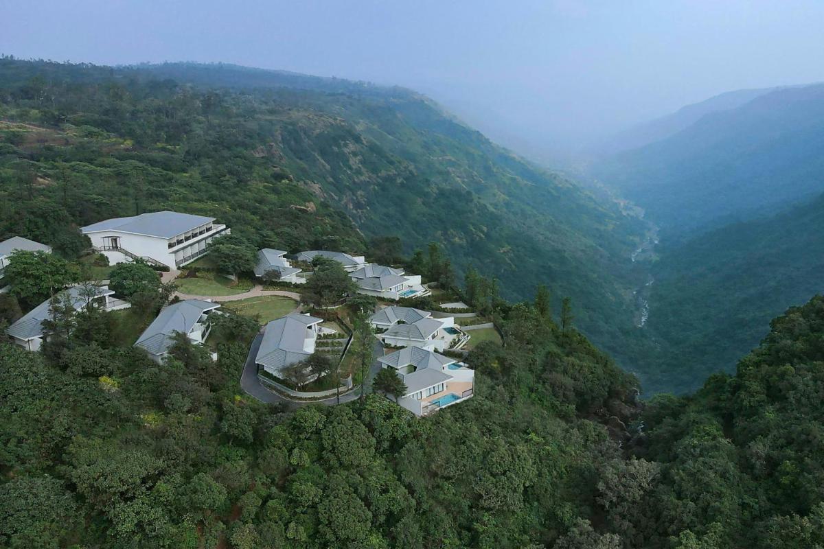 an aerial view of a house in the middle of a mountain at Courtyard by Marriott Mahabaleshwar in Mahabaleshwar