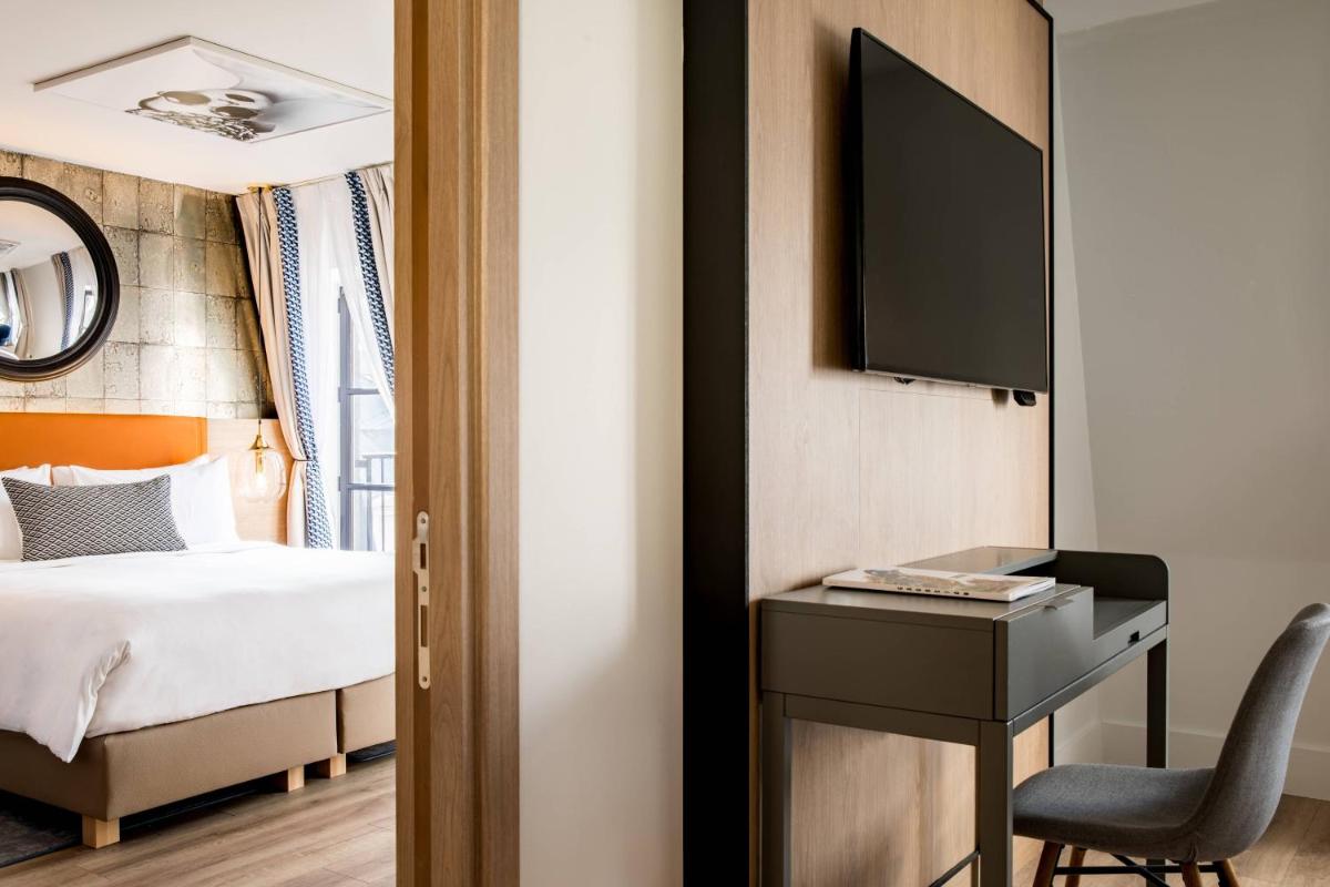 Un ou plusieurs lits dans un hébergement de l'établissement Renaissance Paris Vendome Hotel