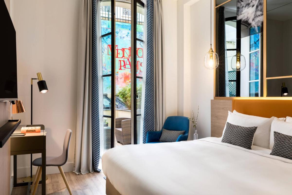 Un ou plusieurs lits dans un hébergement de l'établissement Renaissance Paris Vendome Hotel