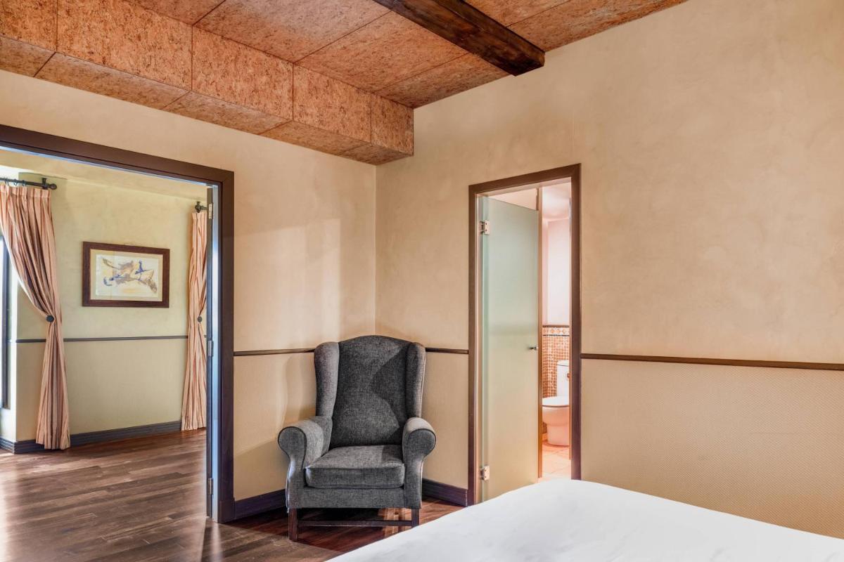 Cama o camas de una habitación en Hotel Palacio del Carmen, Autograph Collection