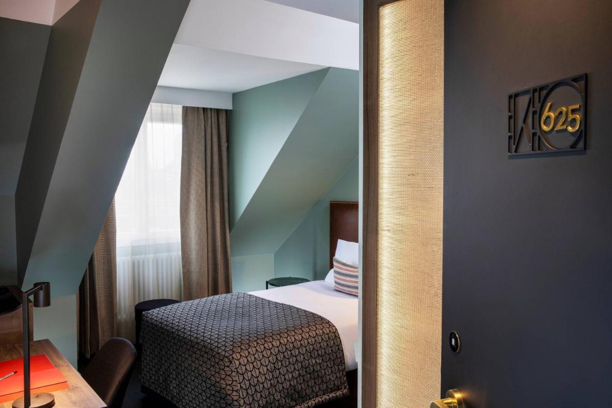 Un ou plusieurs lits dans un hébergement de l'établissement Maison Rouge Strasbourg Hotel & Spa, Autograph Collection