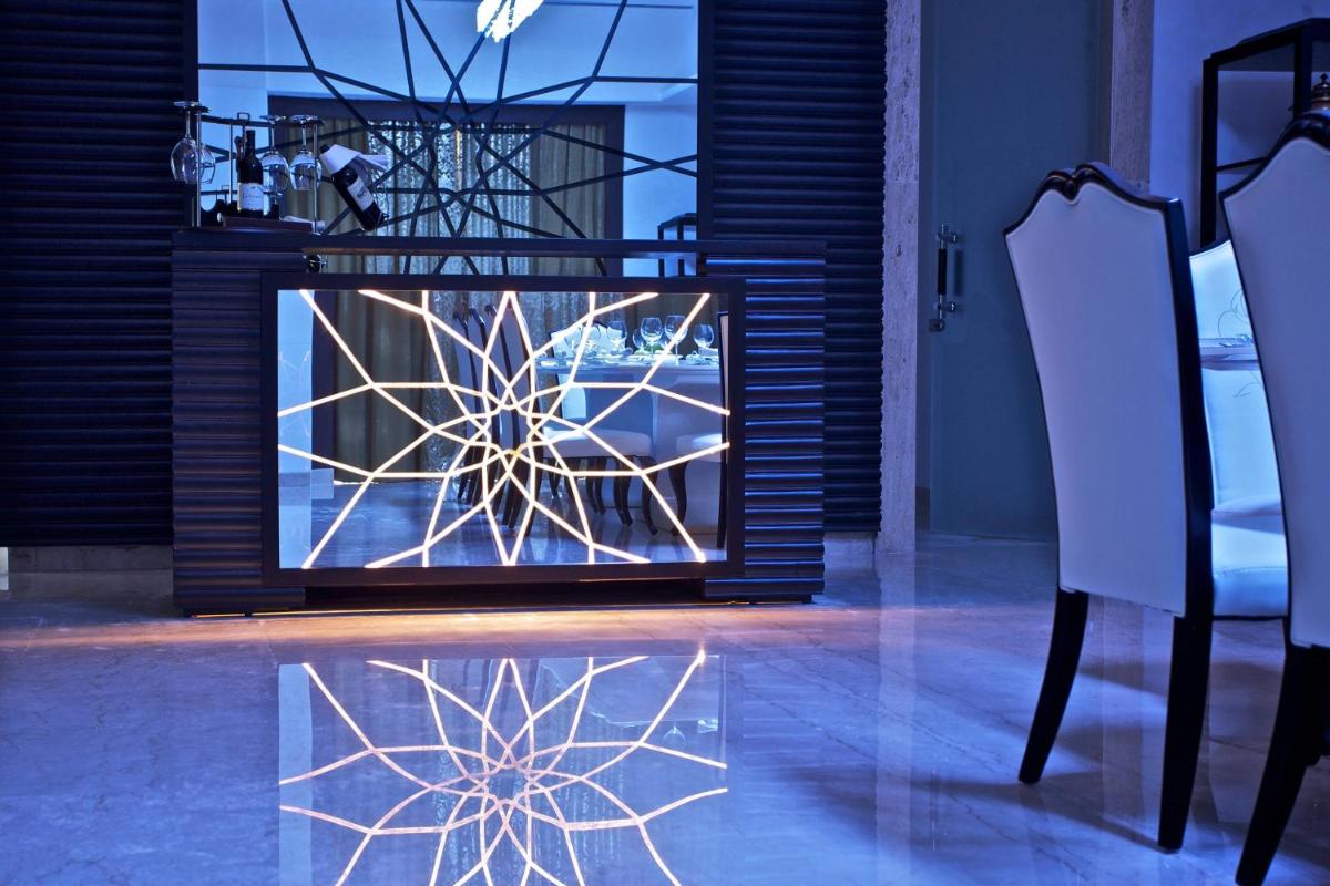a fireplace with a snowflake display in a room at Le Meridien Jaipur Resort & Spa in Jaipur