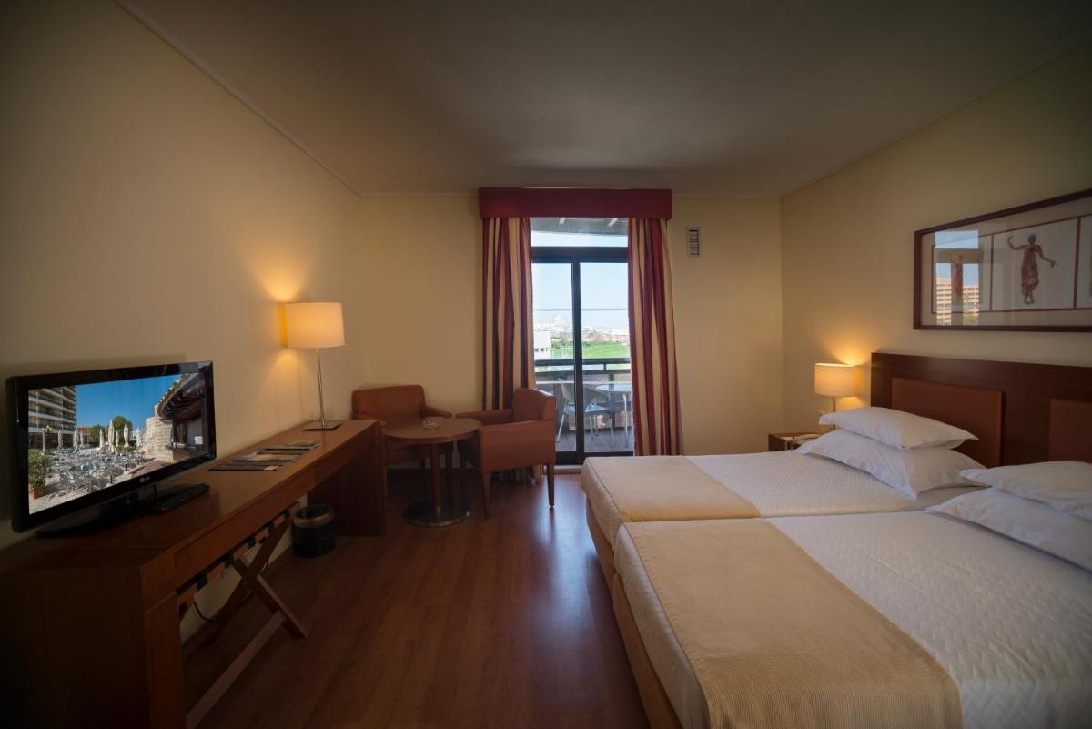 Uma cama ou camas num quarto em Vila Gale Ampalius