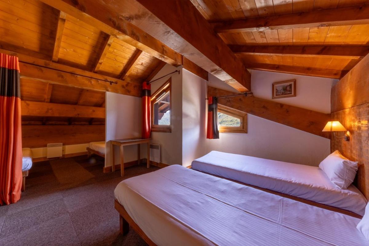 Un ou plusieurs lits dans un hébergement de l'établissement Résidences Village Montana by Les Etincelles