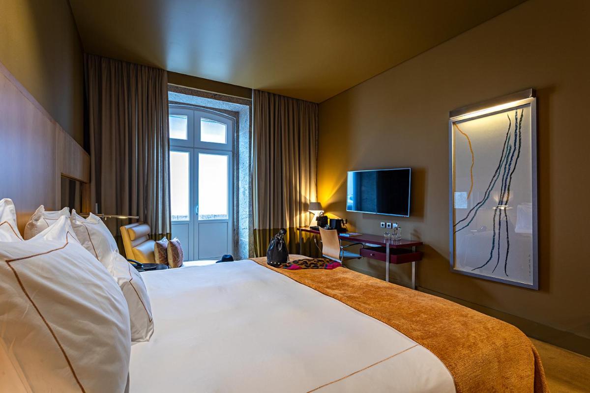 Uma cama ou camas num quarto em Pestana Palacio do Freixo, Pousada & National Monument - The Leading Hotels of the World