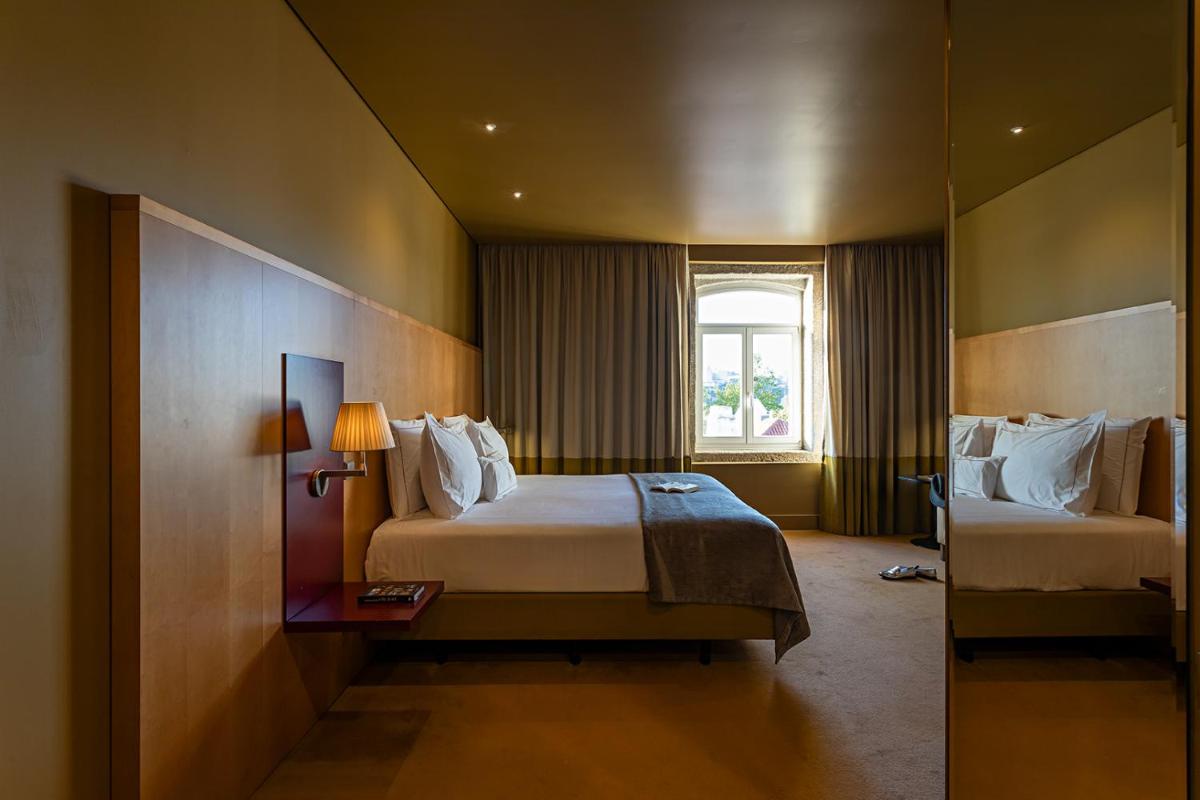 Uma cama ou camas num quarto em Pestana Palacio do Freixo, Pousada & National Monument - The Leading Hotels of the World