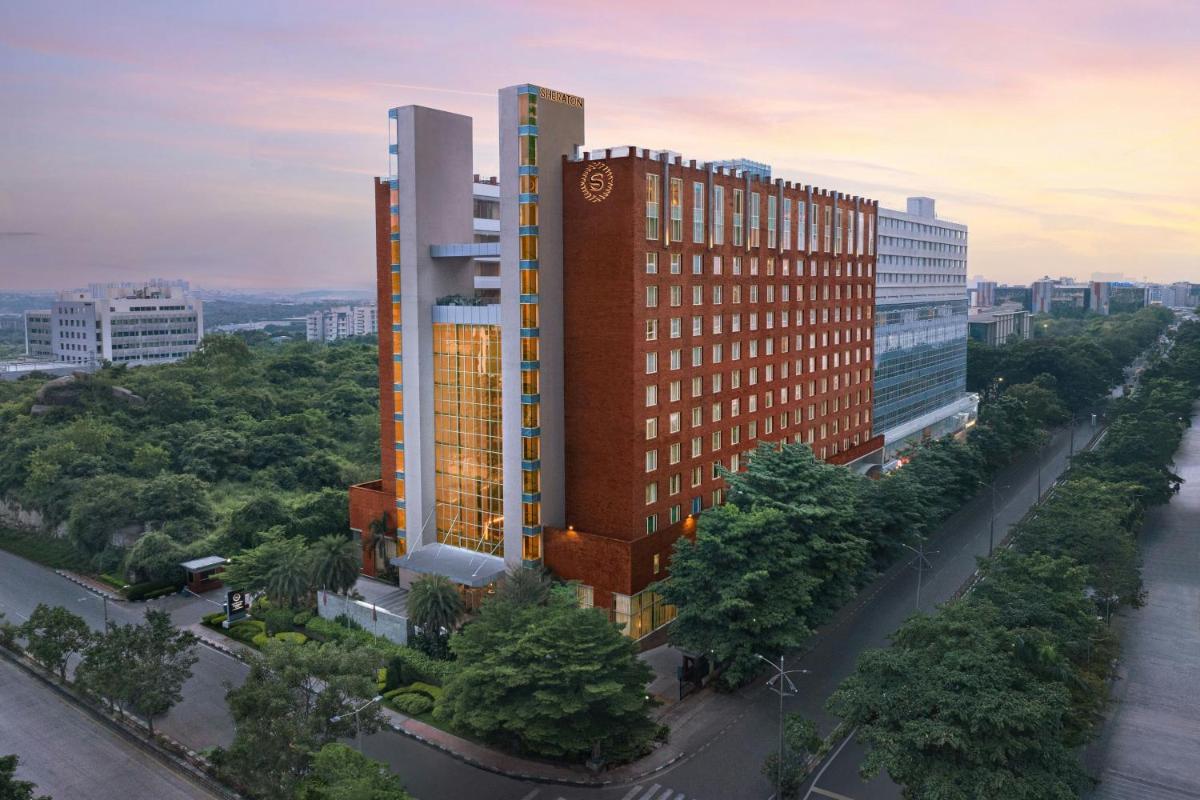 a rendering of a tall building in a city at Sheraton Hyderabad Hotel in Hyderabad