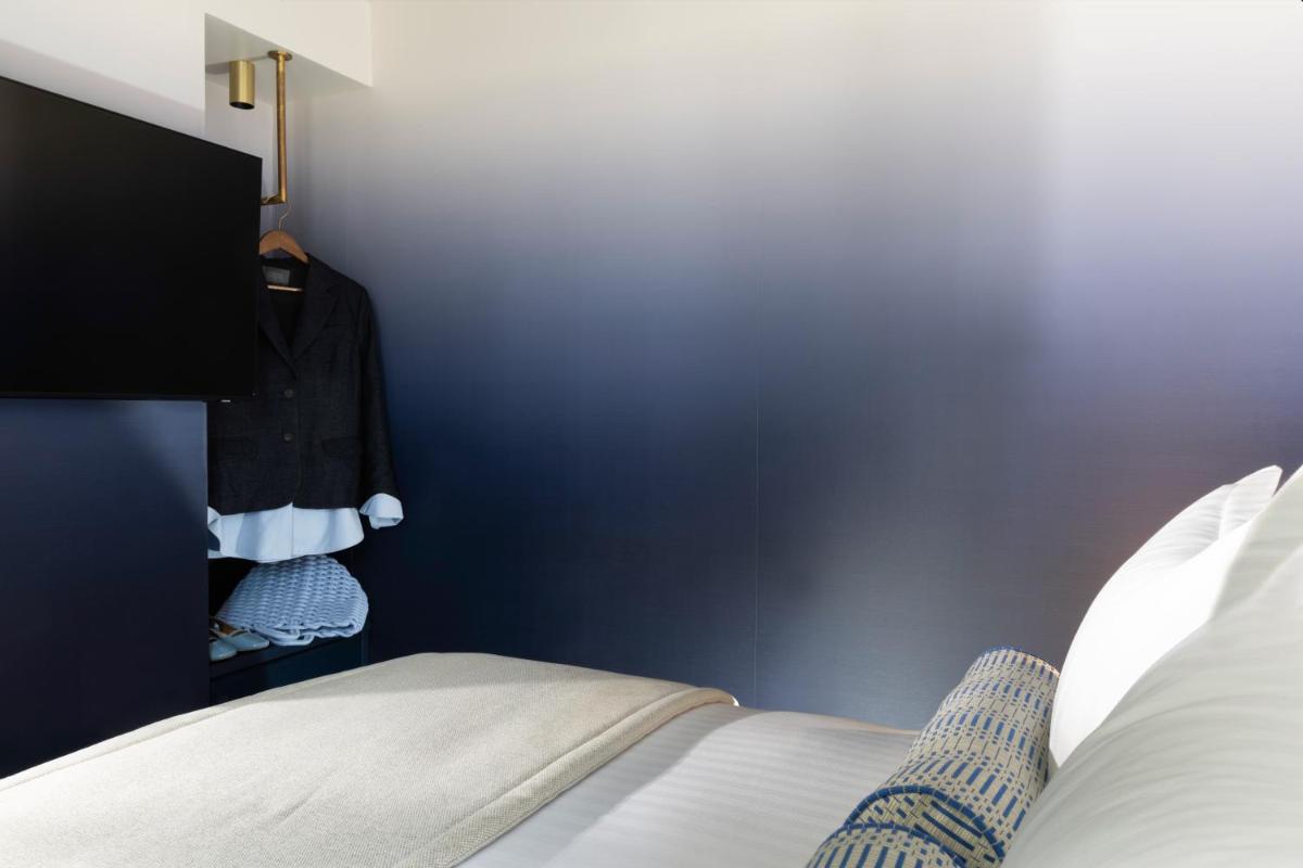 Un ou plusieurs lits dans un hébergement de l'établissement Hôtel Filigrane & Spa