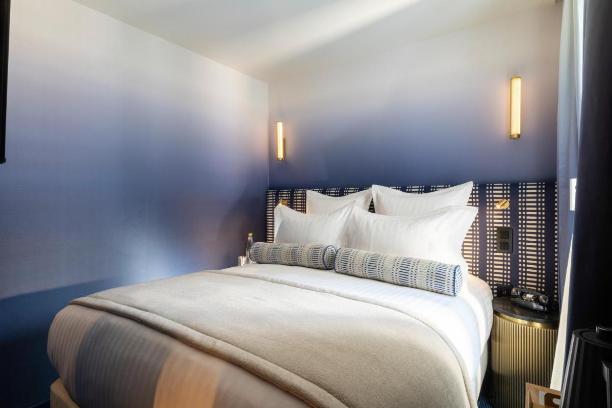 Un ou plusieurs lits dans un hébergement de l'établissement Hôtel Filigrane & Spa