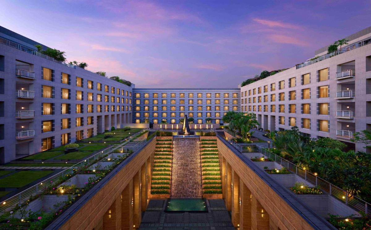 a view of a building with a staircase between two buildings at Grand Hyatt Mumbai Hotel and Residences in Mumbai