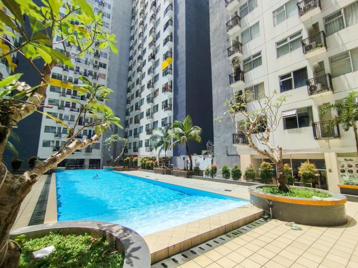 Homey Living 2BR at Jarrdin Cihampelas Apartment By Travelio - Housity