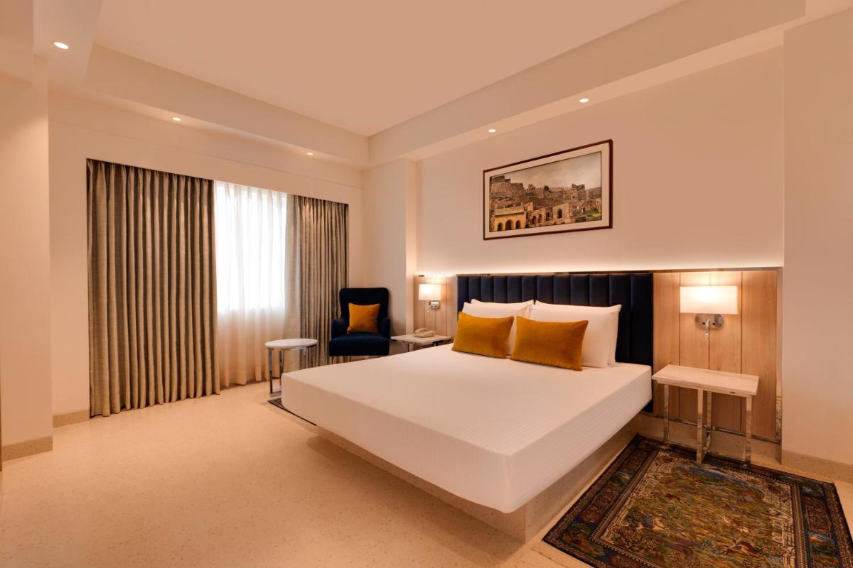 a bedroom with a large white bed in a room at Lemon Tree Premier Hitec City Hyderabad in Hyderabad