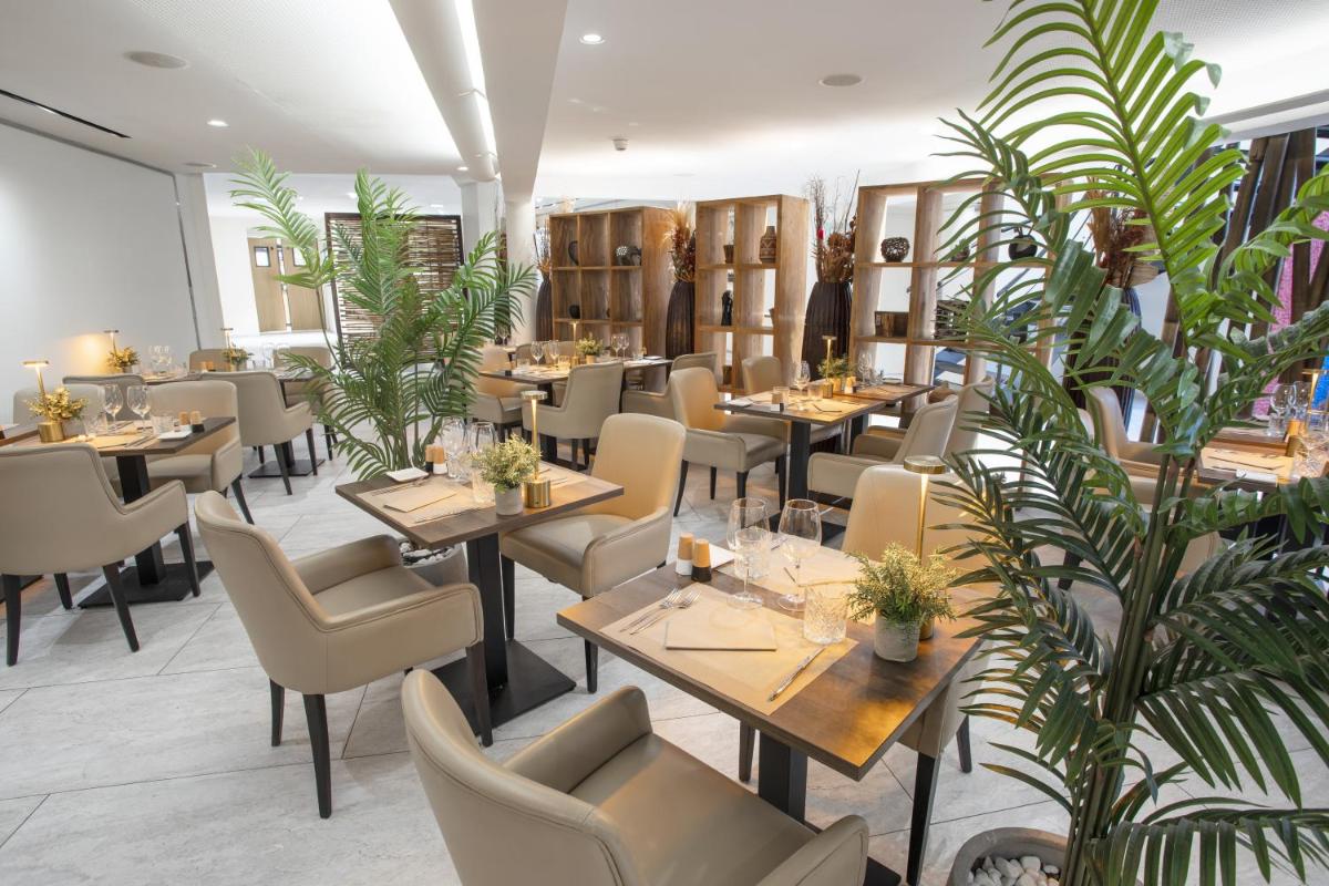 Coin salon dans l'établissement Eden Hotel & Spa