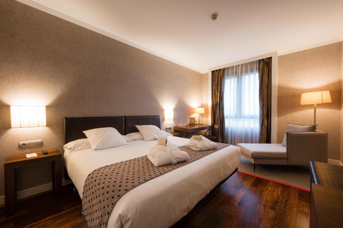 Cama o camas de una habitación en Castilla Termal Olmedo