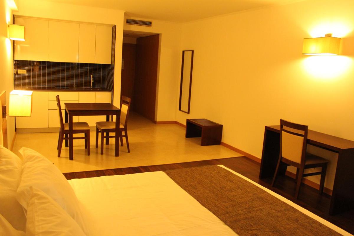 Uma cama ou camas num quarto em Hotel O Gato & Spa