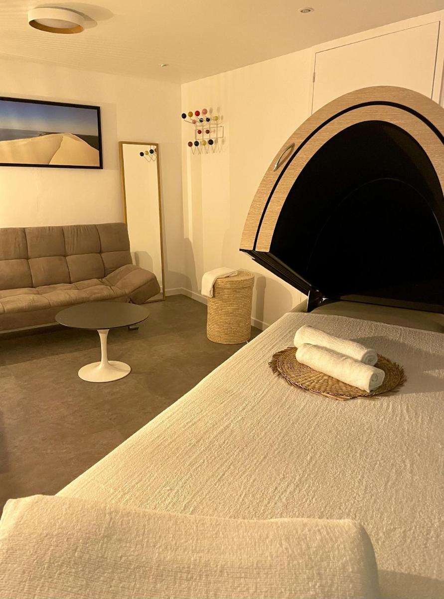 Un ou plusieurs lits dans un hébergement de l'établissement Hôtel Point France
