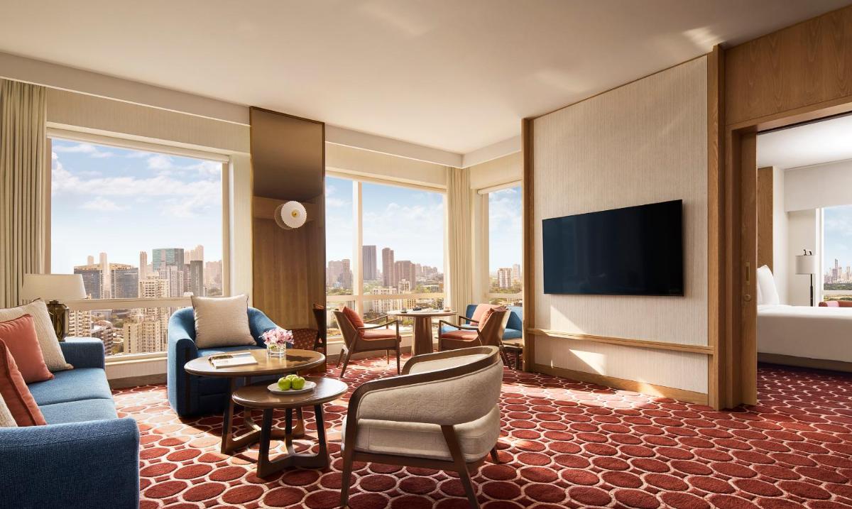 a hotel room with a view of a city at Four Seasons Hotel Mumbai in Mumbai